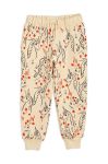 Дитячі бавовняні штани Mini Rodini колір бежевий візерунок
