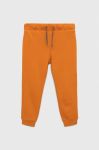 Дитячі бавовняні штани United Colors of Benetton колір помаранчевий з принтом