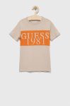 Дитяча бавовняна футболка Guess колір бежевий з принтом (3015521)